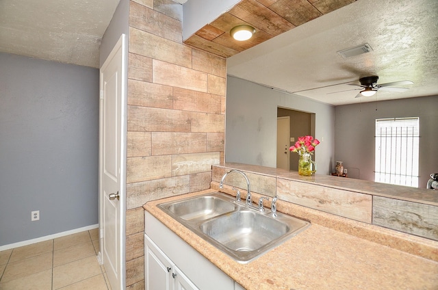 7373 Cook Rd, Houston, TX 77072 - kitchen featuring a sink, a ceiling fan, light tile patterned flooring, a textured ceiling, and light countertops