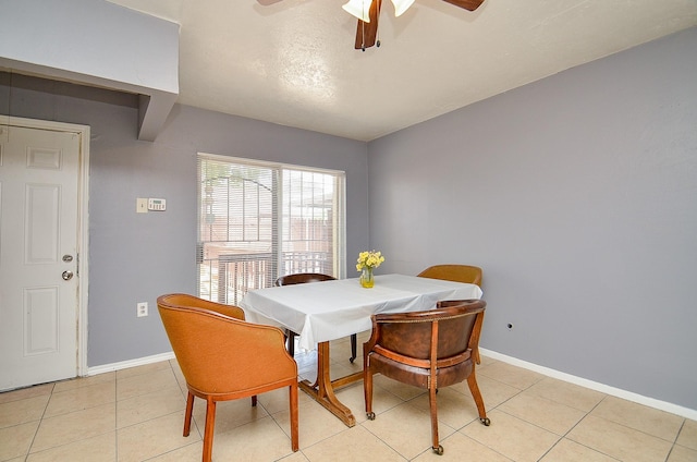 7373 Cook Rd, Houston, TX 77072 - dining space with ceiling fan, light tile patterned floors, and baseboards