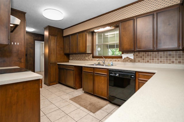 103 N Gordon Dr, Crockett, TX 75835 - kitchen featuring dishwasher, a sink, tasteful backsplash, light countertops, and light tile patterned floors