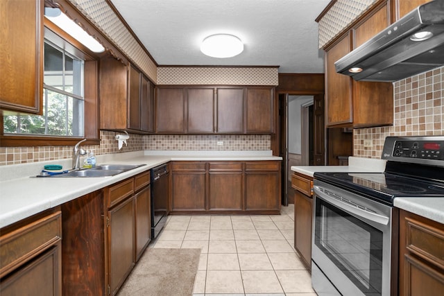 103 N Gordon Dr, Crockett, TX 75835 - kitchen with stainless steel range with electric cooktop, under cabinet range hood, dishwasher, a sink, and decorative backsplash