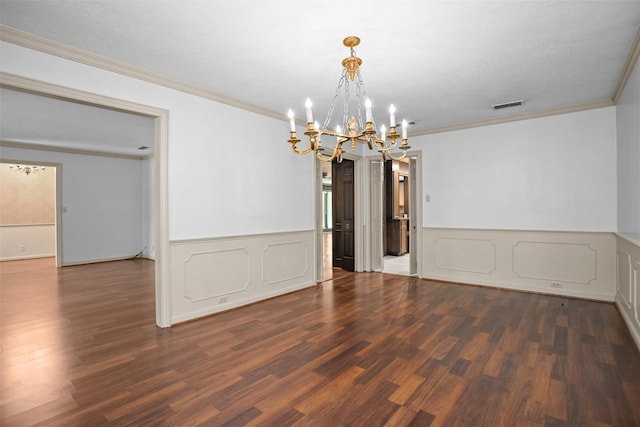 103 N Gordon Dr, Crockett, TX 75835 - empty room with a chandelier, wood finished floors, crown molding, and a wainscoted wall