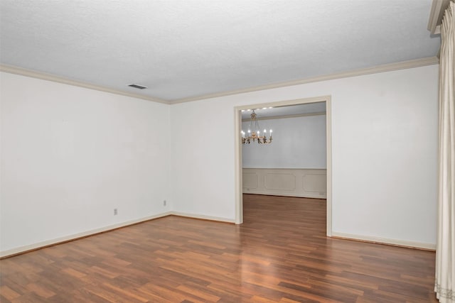 103 N Gordon Dr, Crockett, TX 75835 - empty room featuring wood finished floors, ornamental molding, a chandelier, and baseboards