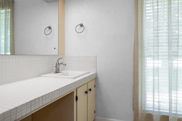 103 N Gordon Dr, Crockett, TX 75835 - bathroom featuring vanity and decorative backsplash