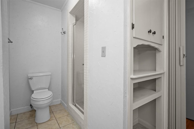 103 N Gordon Dr, Crockett, TX 75835 - full bath with toilet, a stall shower, ornamental molding, tile patterned floors, and baseboards