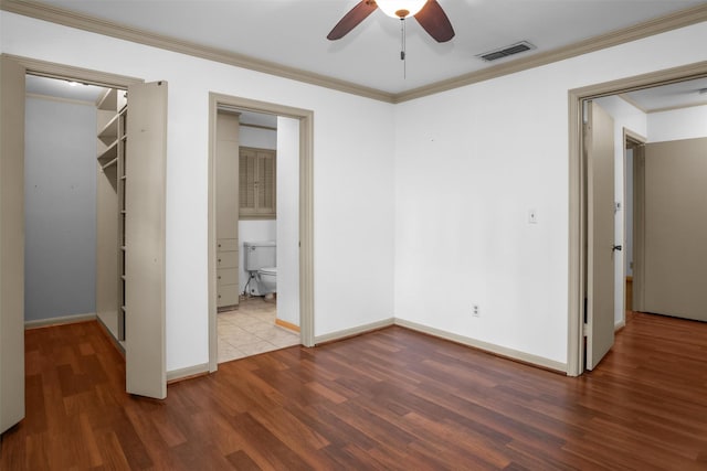103 N Gordon Dr, Crockett, TX 75835 - unfurnished bedroom featuring wood finished floors, baseboards, ornamental molding, and a ceiling fan