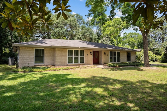 103 N Gordon Dr, Crockett, TX 75835 - ranch-style home with brick siding, a front lawn, and central AC