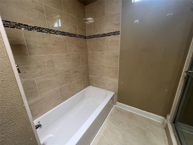 6402 Belarbor St, Houston, TX 77087 - full bath with baseboards and shower / tub combination