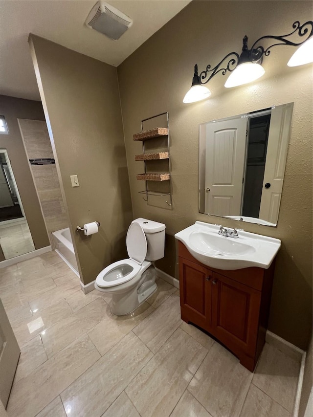 6402 Belarbor St, Houston, TX 77087 - full bathroom with toilet, vanity, and baseboards