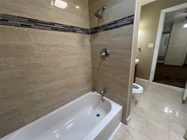 6402 Belarbor St, Houston, TX 77087 - full bathroom featuring toilet, shower / bathtub combination, a ceiling fan, and baseboards