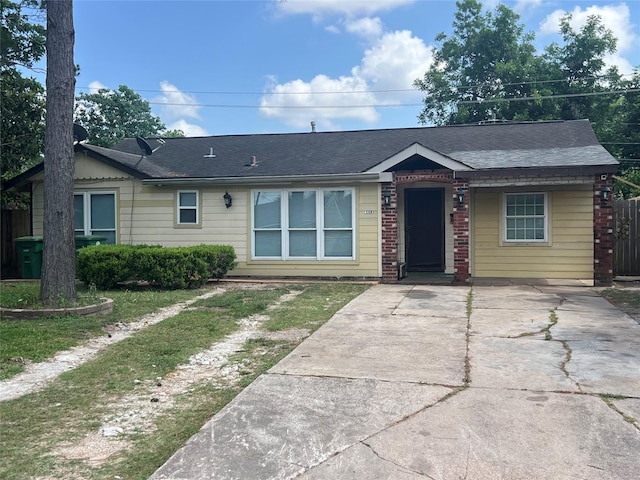 6402 Belarbor St, Houston, TX 77087 - view of front of property featuring concrete driveway, brick siding, and roof with shingles