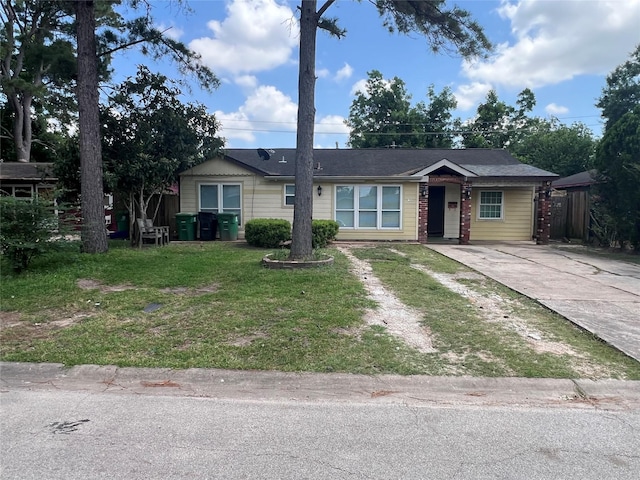 6402 Belarbor St, Houston, TX 77087 - ranch-style home featuring concrete driveway and a front lawn