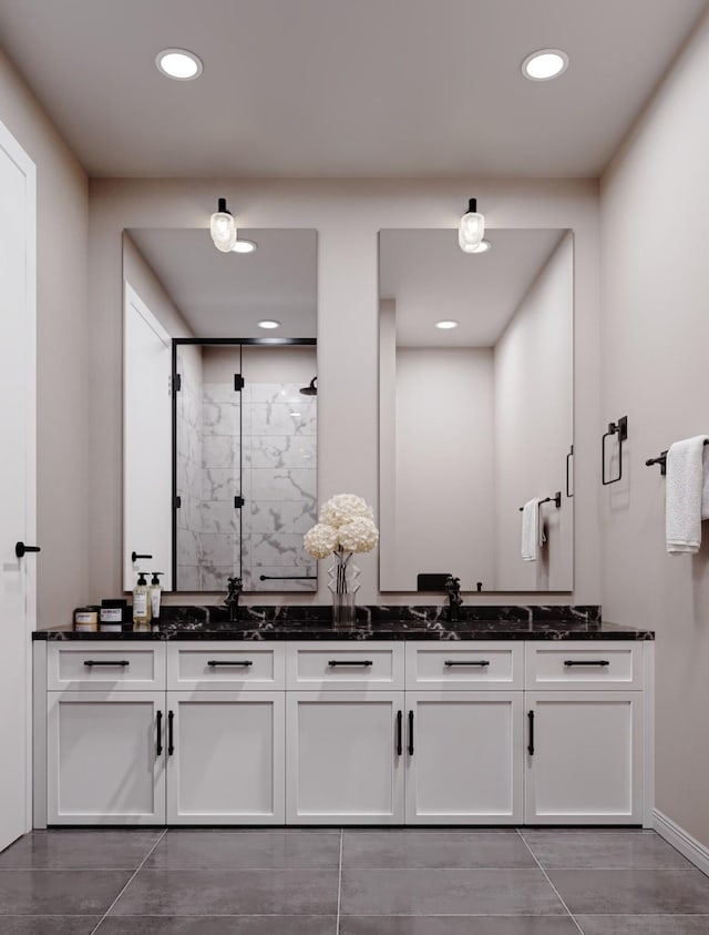 4433 Phlox St, Houston, TX 77051 - full bath with double vanity, a marble finish shower, recessed lighting, and baseboards