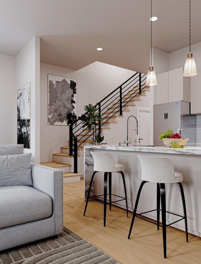 4433 Phlox St, Houston, TX 77051 - living area with stairs, light wood-style flooring, and recessed lighting