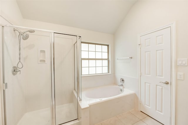 6751 Arlington Dr, Manvel, TX 77578 - full bathroom featuring a shower stall, a garden tub, tile patterned flooring, and vaulted ceiling