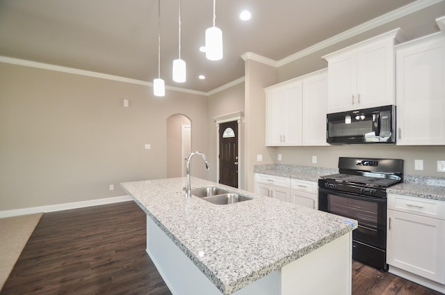 4215 Sterling St, Houston, TX 77051 - kitchen with black appliances, a sink, arched walkways, an island with sink, and dark wood-style flooring