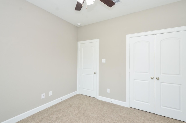 4215 Sterling St, Houston, TX 77051 - unfurnished bedroom with light carpet, a closet, baseboards, and a ceiling fan