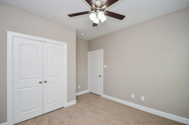 4215 Sterling St, Houston, TX 77051 - unfurnished bedroom with light colored carpet, a closet, baseboards, and ceiling fan