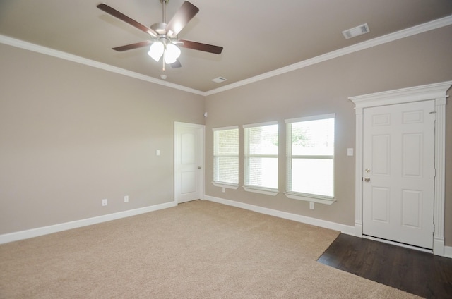 4215 Sterling St, Houston, TX 77051 - empty room with ceiling fan, baseboards, crown molding, and carpet flooring