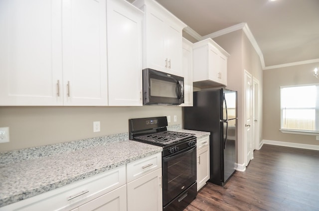 4215 Sterling St, Houston, TX 77051 - kitchen with black appliances, crown molding, dark wood-style flooring, white cabinets, and light stone counters