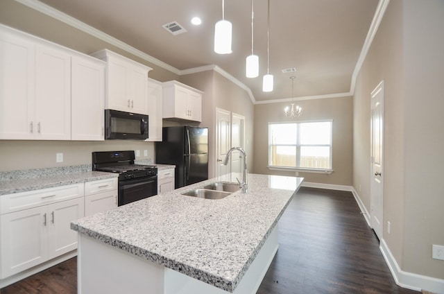 4215 Sterling St, Houston, TX 77051 - kitchen with black appliances, a sink, crown molding, white cabinets, and a kitchen island with sink