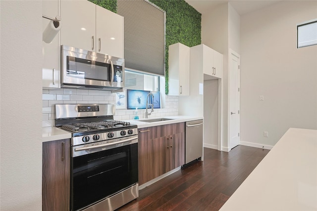 2317 Cleburne St, Houston, TX 77004 - kitchen with appliances with stainless steel finishes, a sink, light countertops, tasteful backsplash, and modern cabinets