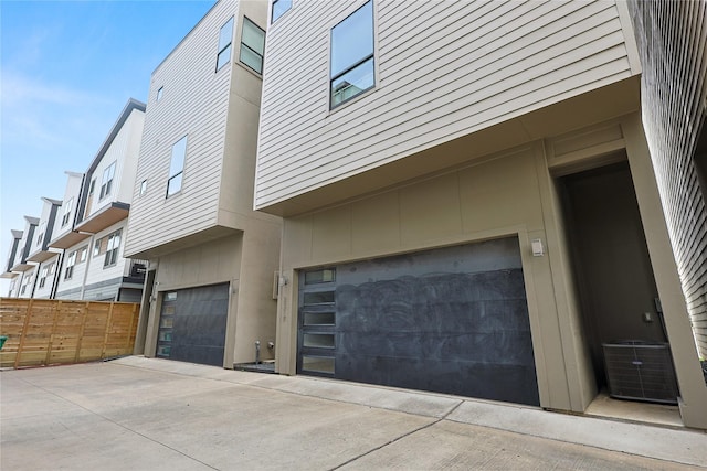 2317 Cleburne St, Houston, TX 77004 - view of property exterior featuring an attached garage and central air condition unit