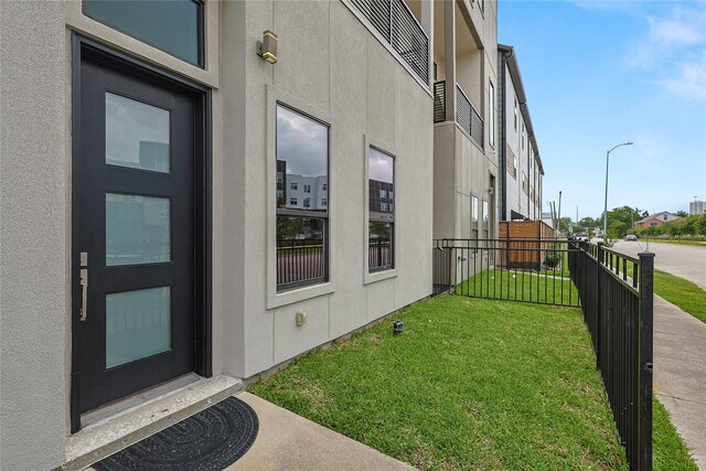 2317 Cleburne St, Houston, TX 77004 - doorway to property featuring stucco siding