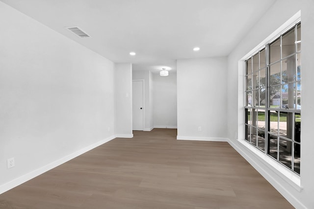 3246 Windmoor Dr, Katy, TX 77449 - spare room featuring baseboards, wood finished floors, and recessed lighting