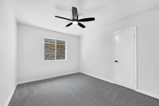 3246 Windmoor Dr, Katy, TX 77449 - unfurnished room featuring dark carpet, ceiling fan, and baseboards