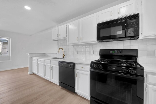 3246 Windmoor Dr, Katy, TX 77449 - kitchen with black appliances, a sink, light countertops, white cabinets, and decorative backsplash