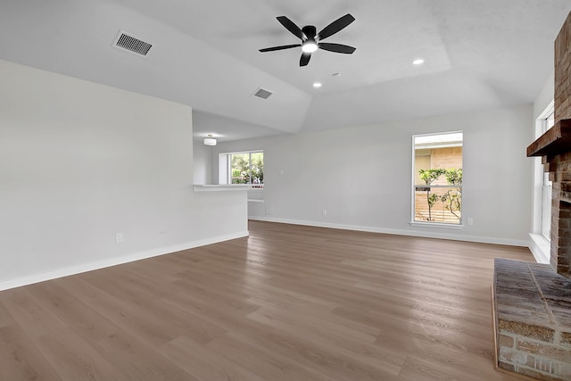 3246 Windmoor Dr, Katy, TX 77449 - unfurnished living room featuring a fireplace, ceiling fan, light wood-style flooring, baseboards, and recessed lighting