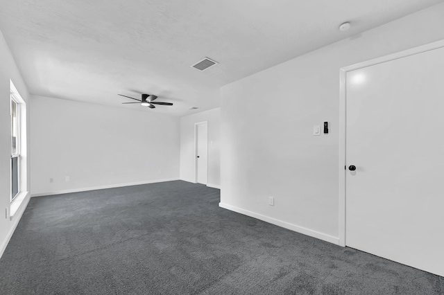 3246 Windmoor Dr, Katy, TX 77449 - unfurnished room with dark colored carpet, a ceiling fan, baseboards, and a smoke detector