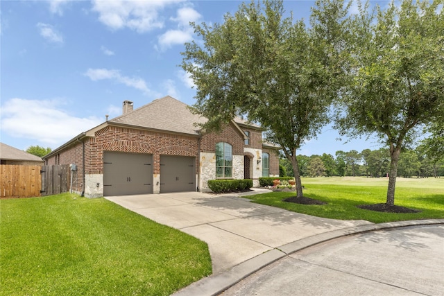 25019 Bahme Springs Ln, Porter, TX 77365 - french country inspired facade featuring brick siding, an attached garage, concrete driveway, a chimney, and roof with shingles
