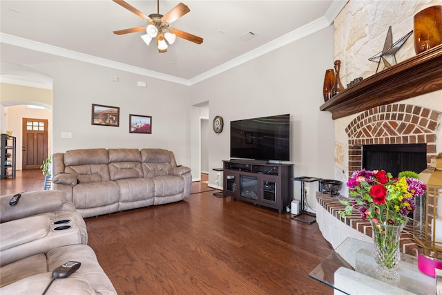 25019 Bahme Springs Ln, Porter, TX 77365 - living area with ceiling fan, arched walkways, crown molding, wood finished floors, and a fireplace