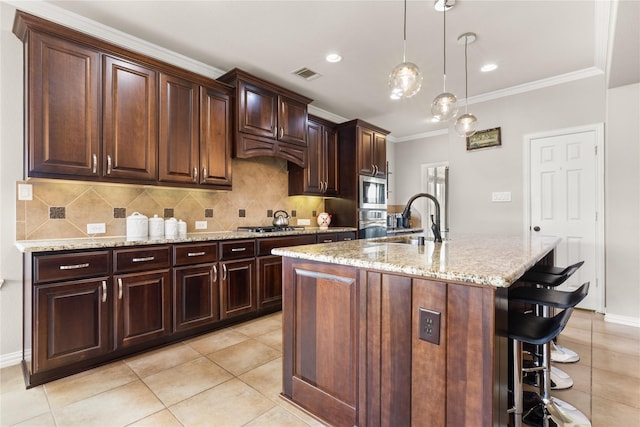 25019 Bahme Springs Ln, Porter, TX 77365 - kitchen with a sink, a breakfast bar area, ornamental molding, backsplash, and light stone counters