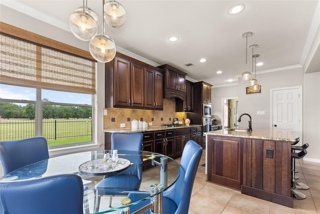 25019 Bahme Springs Ln, Porter, TX 77365 - kitchen with a sink, recessed lighting, backsplash, crown molding, and light stone countertops