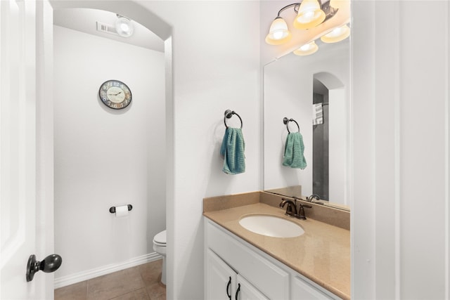 25019 Bahme Springs Ln, Porter, TX 77365 - bathroom featuring vanity, toilet, tile patterned flooring, and baseboards