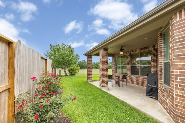 25019 Bahme Springs Ln, Porter, TX 77365 - view of yard featuring a ceiling fan and a patio area