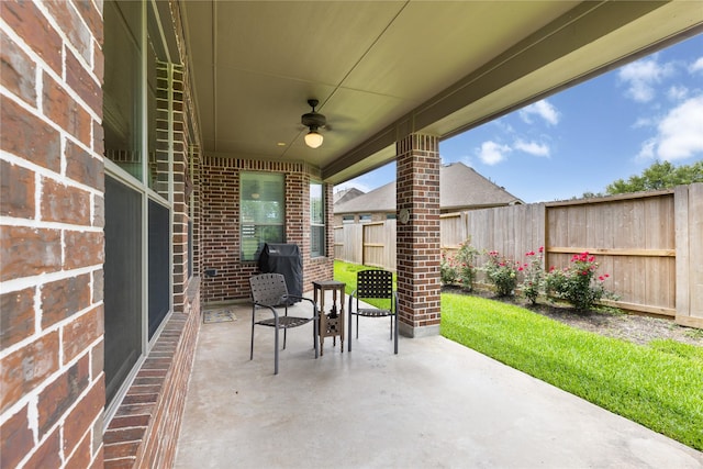 25019 Bahme Springs Ln, Porter, TX 77365 - fenced backyard with ceiling fan, a patio, and a grill