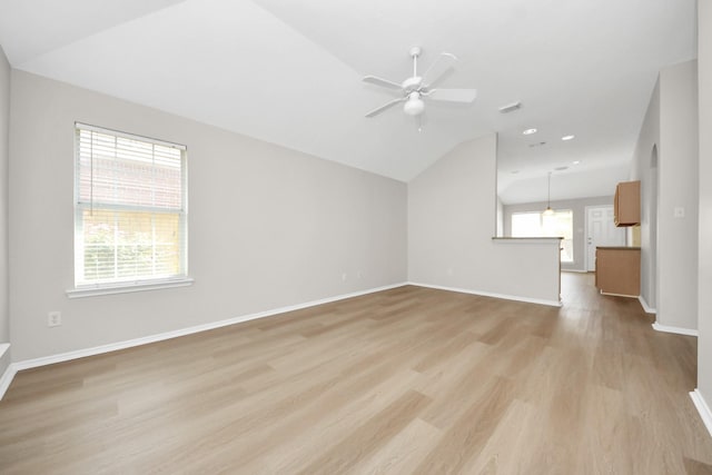 1805 Coronel St, Alvin, TX 77511 - unfurnished living room with light wood-type flooring, a ceiling fan, vaulted ceiling, baseboards, and recessed lighting