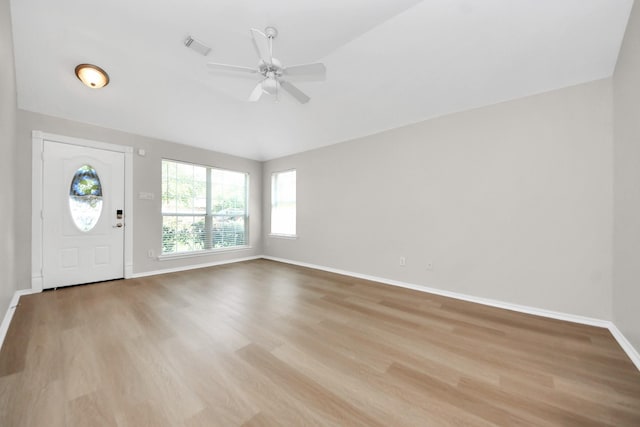 1805 Coronel St, Alvin, TX 77511 - entrance foyer featuring light wood finished floors, lofted ceiling, a ceiling fan, and baseboards