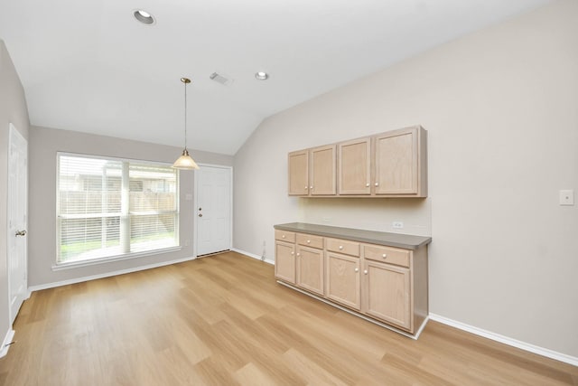 1805 Coronel St, Alvin, TX 77511 - kitchen with light brown cabinets, light wood finished floors, lofted ceiling, baseboards, and recessed lighting