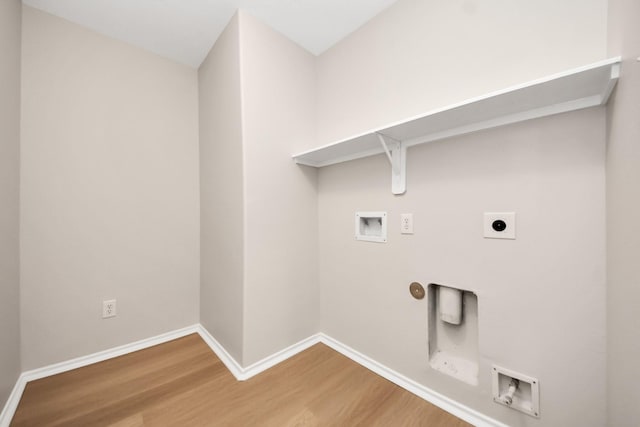 1805 Coronel St, Alvin, TX 77511 - laundry area featuring washer hookup, hookup for an electric dryer, wood finished floors, baseboards, and hookup for a gas dryer