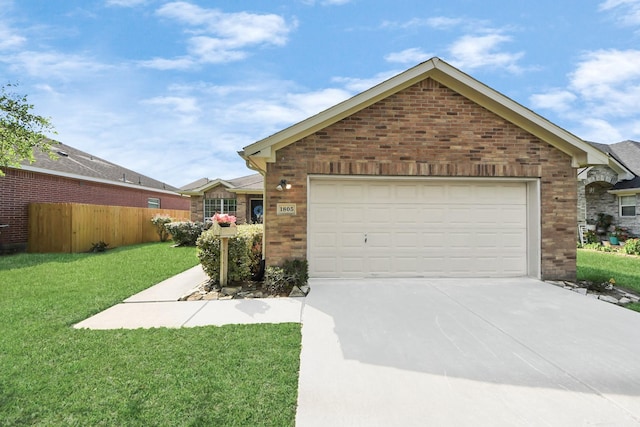 1805 Coronel St, Alvin, TX 77511 - view of front of property featuring concrete driveway, brick siding, and a garage