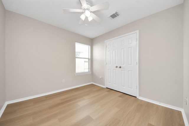 1805 Coronel St, Alvin, TX 77511 - unfurnished bedroom with baseboards, light wood-type flooring, a closet, and ceiling fan
