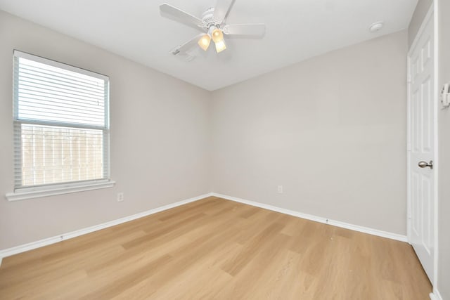 1805 Coronel St, Alvin, TX 77511 - unfurnished room featuring light wood-type flooring, baseboards, a smoke detector, and a ceiling fan