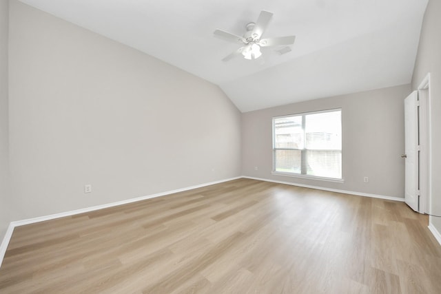 1805 Coronel St, Alvin, TX 77511 - unfurnished room featuring light wood-style floors, lofted ceiling, baseboards, and a ceiling fan