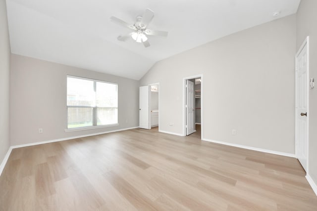 1805 Coronel St, Alvin, TX 77511 - unfurnished bedroom featuring vaulted ceiling, light wood finished floors, baseboards, a spacious closet, and ceiling fan