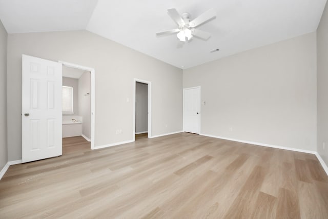 1805 Coronel St, Alvin, TX 77511 - unfurnished bedroom with light wood-type flooring, baseboards, vaulted ceiling, ensuite bathroom, and a ceiling fan