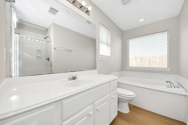 1805 Coronel St, Alvin, TX 77511 - full bath with vanity, a bath, toilet, a shower stall, and wood finished floors